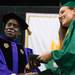 Dr. Arthur Williams hands a graduate her diploma during Huron's class of 2013 graduation ceremony at the Convocation Center, Wednesday, June 5.
Courtney Sacco I AnnArbor.com 
 